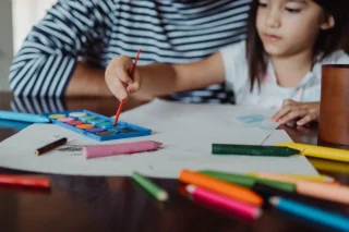 pexels-ketut-subiyanto-4815038 Adult and child engaged in a drawing activity during a creative workshop